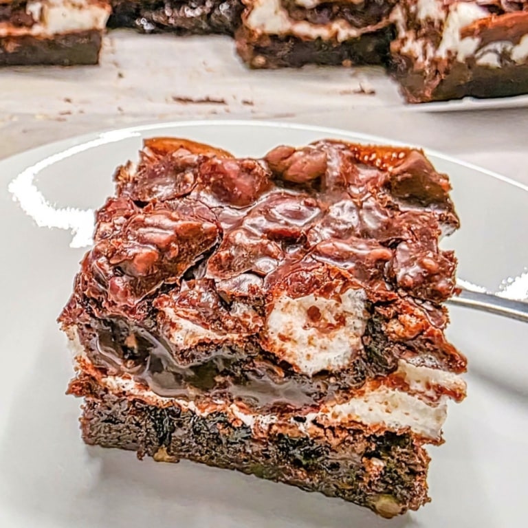 close up view of a slice of mississippi mud cake showing the layers from the side